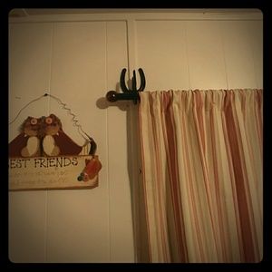 Western curtain rod holder and tie backs